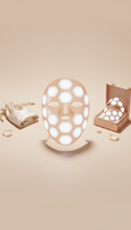 LED facial mask with gold trim