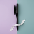 Black edge brush on a lavender and soft teal salon-inspired background