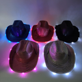 Assorted wide-brim LED cowboy hats glowing in blue, red, black, pink, and white